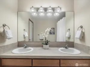 Hall full bath located on the second floor. The double sinks offer incredible convenience while the large vanity provides generous storage below.