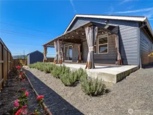 Back patio provides the perfect space to relax or entertain under cover providing shade from the sun or a nice refuge from the rain.