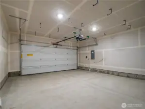 The two car garage is extra-wide providing more room for vehicles, storage, or a work area.