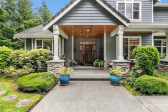 Beautiful front porch with stunning solid wood craftsman style door.