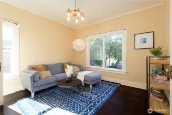 The main floor en suite, with it's pass-through separate entrance to the courtyard and back porch and attached 3/4 bath, is ideal as a guest room or office.