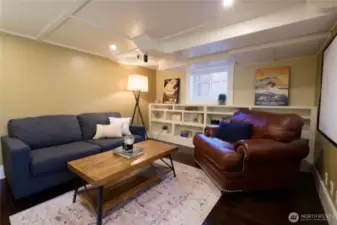 A comfortable semi-subterranean hideaway, the rec room has a projector and could be an exceptional sipping room, or play space/hobby room.