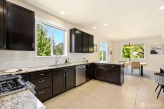 Another view of kitchen, looking back to dining space. Ample storage options in this space!