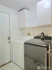 Laundry and back door to covered patio.