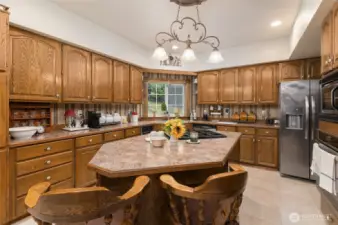 Many cabinets and a convenient island grace the Chef's Kitchen