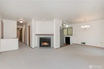 Step inside to a warm and inviting living room centered around a cozy fireplace.