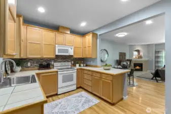 Open kitchen with gleaming hardwoods