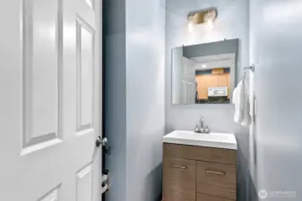 Main-level powder room off kitchen