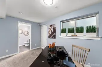 lower level bedroom/den with ensuite bathroom and patio access
