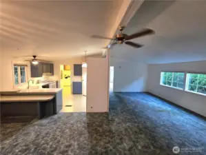 Nice open concept with living room on the right, dining and kitchen on the left looking from the family room.