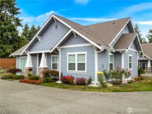 The beautifully landscaped yard frames this home.
