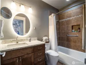 The guest bathroom has a soaking tub for your guests enjoyment.