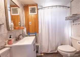 Bathroom and laundry area that needs finishing touches