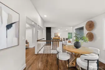 Open-concept design allows clear sightlines from kitchen to dining and living spaces.