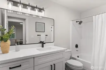 Redone main bath featuring tub and spacious vanity area.