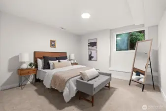 Lower-level bedroom offering privacy with windows closer to the ceiling.