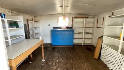 Storage shed at end of carport