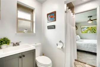 The main floor three-quarter bath is equal parts convenient and stylish—featuring a refreshed vanity that elevates both form and function for comfortable daily use.