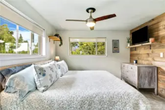 A blend of comfort and character—newer carpet grounds the main floor bedroom while shiplap adds texture and style. Let the natural light do the rest.