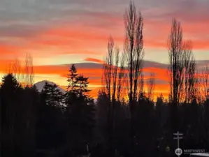 Ready to rise with the mountain? Greet each day with Mt. Rainier in view and sunrises that spill color across your morning ritual. (Picture is zoomed in a bit for the mountain, but not the glorious sky!)