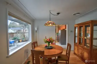 Dining room off the kitchen with refinished wood flooring.