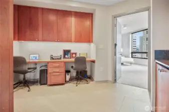 Second view of the office. The door leads to the primary sleeping space; the cabinets to your right house the washer and drawer.