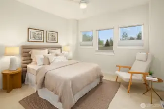 A sweet and romantic primary bedroom. Custom top-down-bottom-up shades allow for privacy.