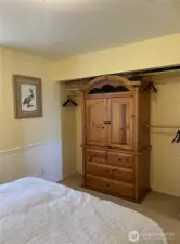 Good sized closet that comes with the armoire.