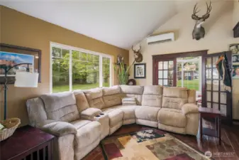 Opens to kitchen and dining area