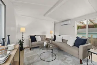 Living room offers fresh paint, LVP floors throughout and a wood burning fireplace.
