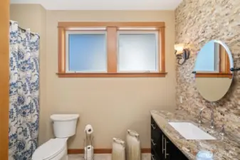 Guest Bathroom has a beautiful rock feature wall