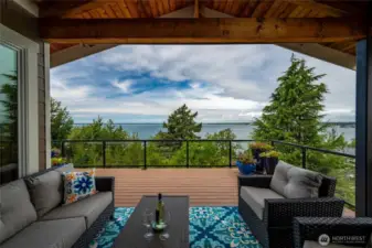 Covered Deck Space offers built in heaters and a natural gas hookup for your grill.  Constructed out of composite wood decking and surrounded by a glass metal framed rail.