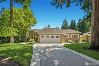 Expansive driveway leads to the front entry