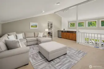 Sophisticated bonus retreat featuring a wet bar—ideal for entertaining in style