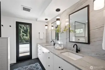Primary bathroom and the access to the deck on the upper floor