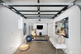 This covered parking space could be your yoga retreat or a gym, radiant floor heating