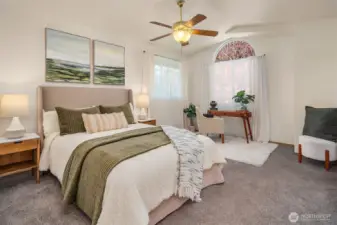 Light & bright primary suite with vaulted ceilings