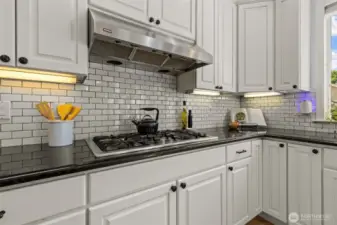 Gas Stove Top, Under Cabinet Lighting, Tile Backsplash