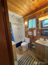 Relax in the tub while gazing up at the mosiac anchor handmade by the original owner.