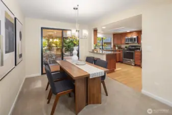 Dining area just off the kitchen featuring granite counters, stainless steel appliances, and plenty of cabinet space.