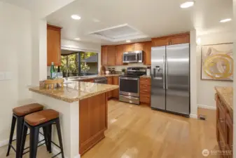Kitchen featuring granite counters, stainless steel appliances, and plenty of cabinet space.