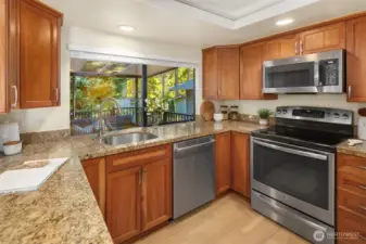 Kitchen featuring granite counters, stainless steel appliances, and plenty of cabinet space.