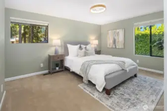 Master bedroom with remote operated low profile ceiling fan with light, French doors, large closet, and attached 3/4 bath.