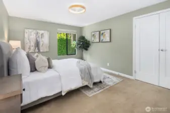 Master bedroom with remote operated low profile ceiling fan with light, French doors, large closet, and attached 3/4 bath.