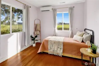 The secondary bedroom is cheerful and bright