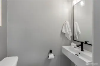 Powder room in hallway.