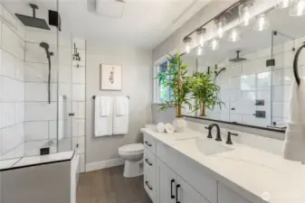 Updated bathroom with with ample vanity space and natural light.