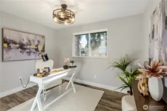 This bright and airy room features a spacious layout, perfect for a home office. This room also includes built in shelving in the closet.