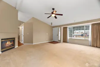 Light and bright living room with gas fireplace.