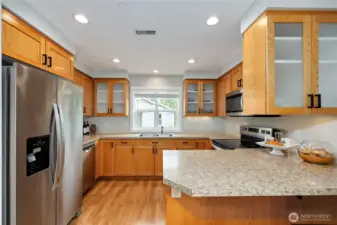 Kitchen is a dream with lots of counterspace and storage. Fridge, dishwasher, range and microwave all stay.